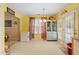 Kitchen with a view of the eating area, featuring double doors to the backyard at 2116 Sterling Creek Ln, Franklinton, NC 27525