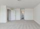Expansive carpeted bedroom provides open space with access to an ensuite bathroom at 218 Faith Avenue, Sanford, NC 27330