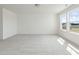 Large carpeted bedroom featuring ample space and bright lighting from large windows and overhead at 218 Faith Avenue, Sanford, NC 27330