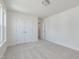 Bedroom with neutral carpet, white walls, a window and two doors at 218 Faith Avenue, Sanford, NC 27330