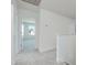 Hallway with neutral carpet, white walls, doors and trim at 218 Faith Avenue, Sanford, NC 27330