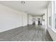 Large living room featuring an open floor plan with view to kitchen and large windows at 218 Faith Avenue, Sanford, NC 27330
