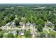 Aerial view shows the boundaries of the large tree-covered lot that the home resides on at 219 E Nash St, Spring Hope, NC 27882