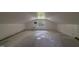 Spacious attic with a window offering natural light, ideal for storage or renovation at 219 E Nash St, Spring Hope, NC 27882
