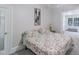Cozy bedroom with a floral patterned bedspread and classic decor at 219 E Nash St, Spring Hope, NC 27882