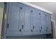 Close up of built in blue cabinets in the mud room featuring dark hardware at 219 E Nash St, Spring Hope, NC 27882