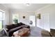 Living room with a plush brown sofa, a glass-topped coffee table, and neutral decor at 219 E Nash St, Spring Hope, NC 27882