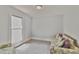 Comfortable living room with decorative sofa, natural light, and a cozy ambiance at 219 E Nash St, Spring Hope, NC 27882