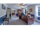 Spacious office space with a large desk, a ceiling fan, and natural lighting, perfect for a productive work environment at 219 E Nash St, Spring Hope, NC 27882