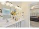 Bathroom featuring double vanity, soaking tub, and a doorway to a bedroom at 2311 Woodwyck Way, Raleigh, NC 27604