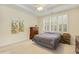 Bright bedroom with natural light, neutral colors and a ceiling fan at 2311 Woodwyck Way, Raleigh, NC 27604