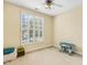 Well-lit bedroom with carpeted floors and a large window at 2311 Woodwyck Way, Raleigh, NC 27604