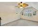Bonus room featuring neutral carpet, artwork, and a unique ceiling fan at 2311 Woodwyck Way, Raleigh, NC 27604