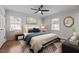 Beautifully staged bedroom with a ceiling fan, natural light, and modern décor at 2324 Hoskins Rd, Burlington, NC 27215