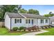 Charming white house with well-manicured landscaping and a walkway leading to the front entrance at 2324 Hoskins Rd, Burlington, NC 27215