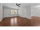 Spacious living room featuring hardwood floors, neutral paint, and a ceiling fan at 2324 Hoskins Rd, Burlington, NC 27215