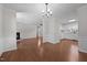 Open concept living room and kitchen, featuring hardwood floors, a fireplace, and natural light at 2324 Hoskins Rd, Burlington, NC 27215