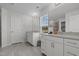 Bright bathroom featuring a double vanity, a large mirror, and tile flooring at 2346 Mckenzie Ridge Ln, Apex, NC 27502