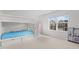 Carpeted bedroom with bunk beds and a view of the neighboring home at 2346 Mckenzie Ridge Ln, Apex, NC 27502