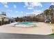 Community pool with beach entrance, playground, shade umbrellas, and slide for Gathering fun at 2346 Mckenzie Ridge Ln, Apex, NC 27502