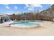 Community pool with beach entrance, playground, shade umbrellas, and slide for Gathering fun at 2346 Mckenzie Ridge Ln, Apex, NC 27502