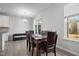 Bright dining room with a window, sliding glass door and dining set at 2346 Mckenzie Ridge Ln, Apex, NC 27502