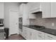 Clean kitchen with stainless steel appliances, ample countertop space, and modern white cabinetry at 2346 Mckenzie Ridge Ln, Apex, NC 27502