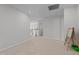 Neutral carpeted loft area featuring three windows and an art easel for kid friendly living at 2346 Mckenzie Ridge Ln, Apex, NC 27502