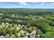 Aerial view of neighborhood near 2425 Lemuel Dr surrounded by mature trees and lush landscaping at 2425 Lemuel Dr, Raleigh, NC 27615