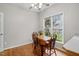 Bright breakfast nook with a wooden table and chairs by a window at 2425 Lemuel Dr, Raleigh, NC 27615