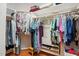 Organized walk-in closet with ample hanging space, shelving, and hardwood floors at 2425 Lemuel Dr, Raleigh, NC 27615