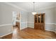 Inviting dining room with hardwood floors that connects seamlessly to the nearby kitchen at 2425 Lemuel Dr, Raleigh, NC 27615