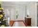 Bright foyer with hardwood floors, complemented by natural light and traditional accents at 2425 Lemuel Dr, Raleigh, NC 27615