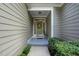 Close up of a lovely front door with a wreath, covered entryway, and landscaped surroundings at 2425 Lemuel Dr, Raleigh, NC 27615
