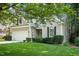 Inviting home with lush lawn, mature trees, and attached garage enhancing curb appeal at 2425 Lemuel Dr, Raleigh, NC 27615