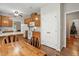 Kitchen leading to breakfast nook with hardwood floors and ample cabinets at 2425 Lemuel Dr, Raleigh, NC 27615