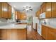 Spacious kitchen features white appliances, hardwood floors and ample cabinets at 2425 Lemuel Dr, Raleigh, NC 27615