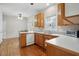 Eat-in kitchen features hardwood floors, white countertops, and wood cabinets at 2425 Lemuel Dr, Raleigh, NC 27615