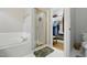 Main bathroom features soaking tub with shower and walk-in closet at 2425 Lemuel Dr, Raleigh, NC 27615
