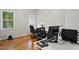 Office space featuring two desks, multiple monitors and hardwood flooring at 2425 Lemuel Dr, Raleigh, NC 27615