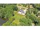 Aerial view of home with pool, pool house and grassy field at 2508 Kearney Rd, Wake Forest, NC 27587