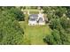 Aerial shot of home with a pool house, inground pool, and a long driveway at 2508 Kearney Rd, Wake Forest, NC 27587