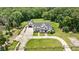 Wide aerial shot of property with a long drive, manicured lawn, and wooded perimeter at 2508 Kearney Rd, Wake Forest, NC 27587