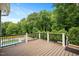 Elevated wooden deck overlooking the backyard and pool provides ample space for outdoor relaxation at 2508 Kearney Rd, Wake Forest, NC 27587