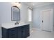 Bathroom showcasing white marble counters, a dark vanity, and a hexagon tile floor at 2508 Kearney Rd, Wake Forest, NC 27587