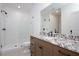 An elegant bathroom features a walk-in shower and granite countertop at 2508 Kearney Rd, Wake Forest, NC 27587