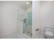 Modern bathroom featuring a glass enclosed shower with white subway tile and white tile floors at 2508 Kearney Rd, Wake Forest, NC 27587