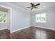 Light-filled bedroom with hardwood floors, two windows and crown molding at 2508 Kearney Rd, Wake Forest, NC 27587