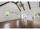 Spacious bedroom featuring wood floors, vaulted ceilings with beams and an adjacent bathroom at 2508 Kearney Rd, Wake Forest, NC 27587