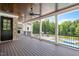 Expansive covered patio with wood ceiling, ceiling fan, brick fireplace and views of the pool at 2508 Kearney Rd, Wake Forest, NC 27587